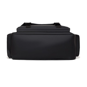 Bottom view of large black waterproof messenger bag with durable matte fabric and straps