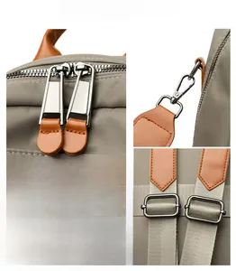 Detail of custom hardware, durable grey fabric, and premium stitching on women's backpack