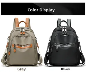 Gray and black nylon travel backpacks with multiple zipper pockets for women