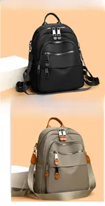 Detail showing high-density waterproof nylon backpacks in black and khaki colors