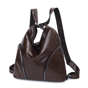 Vintage dark brown faux leather backpack with triangular silhouette and metal zippers