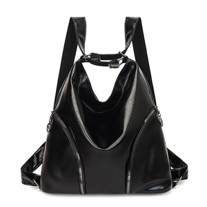 Vintage glossy black leather backpack for women featuring stylish vertical silver zippers
