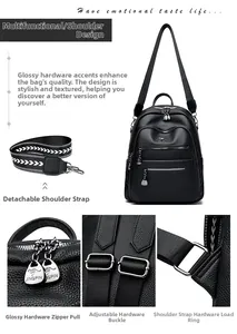 Detail of black pebbled leather backpack with detachable woven strap and silver hardware