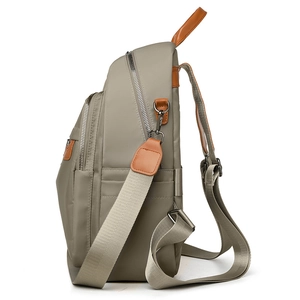Quality nylon travel backpack for women with brown leather handles and side pockets