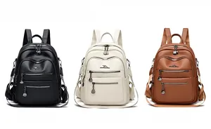 Three large capacity soft leather backpacks in black, cream, and brown with kangaroo logo