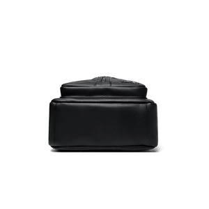 Chic black lychee grain PU leather backpack showing reinforced base and quality stitching