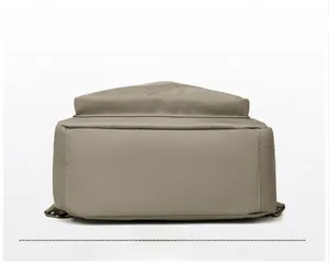 Detailed base view of the large capacity nylon backpack showing clean bottom stitching