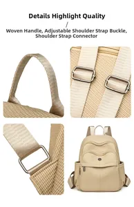 Detail view of woven handles and metal buckles on a beige large capacity backpack