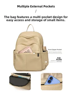 Detail view of large capacity beige backpack showing organized storage compartments
