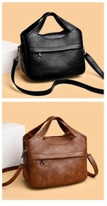 Detail view of large capacity handbags showing leather texture and detachable shoulder straps