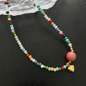 Colorful beaded heart necklace with multi-colored crystals and golden metal pendant