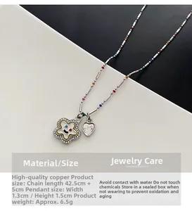 Vue détaillée du collier en cuivre argenté avec pendentif étoile souriante et dimensions