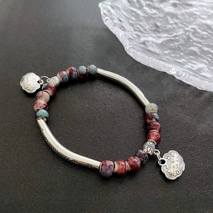 Handmade ceramic beaded bracelet with marble texture beads and silver lock charms