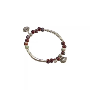 Handmade ceramic beaded bracelet with red beads and vintage silver embossed tubes