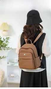 Brown multi-pocket water-resistant backpack showing a spacious design and side pockets