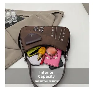 Detailed interior view of brown leather shoulder bag showing spacious storage capacity