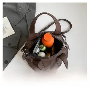 Top view of large capacity dark brown leather tote bag showing spacious interior compartment