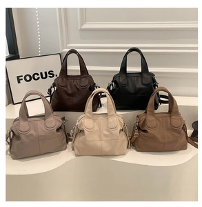 Detailed comparison of Five retro satchel handbags in various colors on a white pedestal