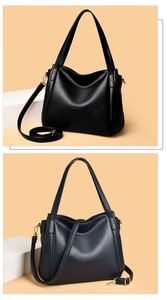 Detailed texture of black and dark blue pebbled leather tote bags with gold hardware