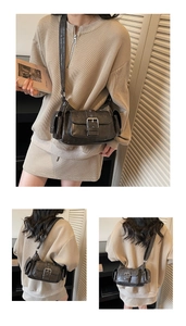Detail view of retro brown crossbody bag with multi-pocket design and metal buckles