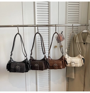 Row of vintage faux leather shoulder bags in black, coffee, brown, and cream white colors
