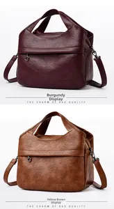 Detail view of wine red and yellow-brown PU leather handbags with kangaroo embossed logo
