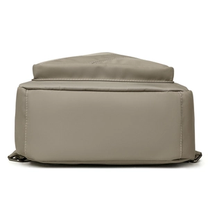 Large capacity nylon backpack in khaki color showing durable reinforced bottom stitching