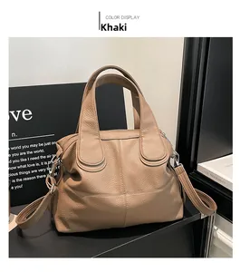 Detailed view of khaki tote bag with litchi texture leather and adjustable shoulder strap