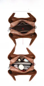 Internal layout of brown leather handbag showing large capacity and striped fabric lining