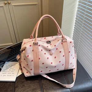 Pink corduroy travel bag with strawberry print and leather handles for women