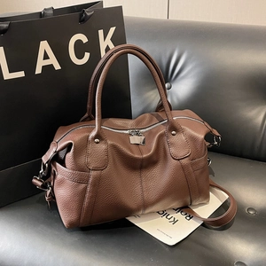 Vintage brown pebble leather bowling tote bag with top handles and adjustable strap