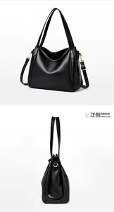 Front and side profile detail of a black litchi pattern leather bucket bag with gold hardware