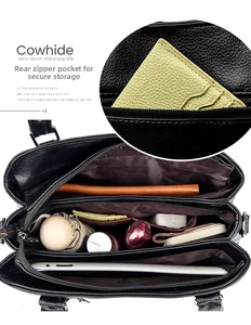 Litchi pattern cowhide bucket bag showing internal multi-layer storage and rear zipper pocket