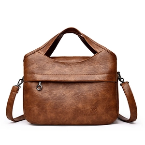 Brown leather handbag with litchi texture, multi-layer compartments and adjustable strap