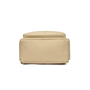 Fashionable beige canvas backpack for women featuring large capacity and durable stitching