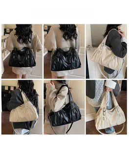Model showcasing large capacity lychee texture tote bag in black and off-white colors