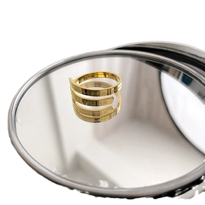 Polished gold spiral titanium steel ring with stronger engraving on a mirror