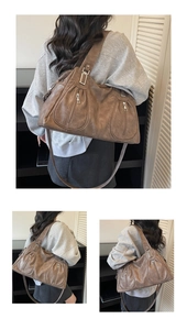 Detail view of vintage brown tote bag with lychee texture and multi-pocket design