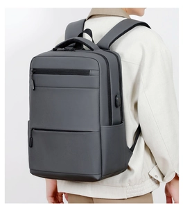 Detail view of water-resistant gray business backpack featuring integrated external USB port