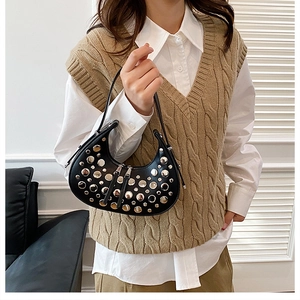 Fashionable black crescent rivet handbag with silver studs on matte leather finish
