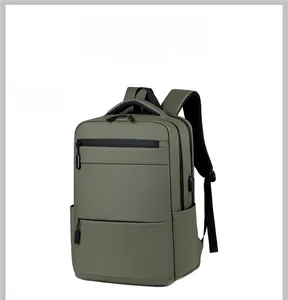 Detail view of military green business backpack with multi-pockets and USB charging port