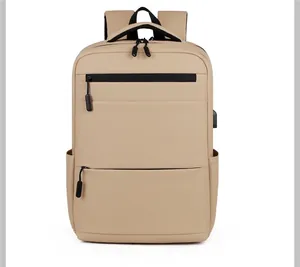 Front view of khaki water-resistant business backpack with dual zip pockets and USB port