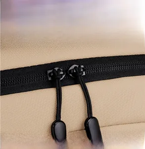 Close-up of durable honeycomb fabric and smooth double zipper on the khaki laptop backpack
