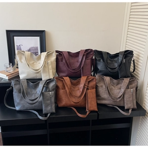 Detailed display of vintage PU leather tote bags in six elegant colors with matching pouches