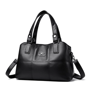 Premium black pebble leather bucket bag with silver metal logo and adjustable shoulder strap