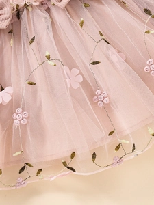 Pink tulle dress for girls featuring delicate floral embroidery and 3D fabric petals