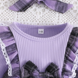 Detail of baby dress with purple ribbed knit fabric, plaid bow, and lace trimming
