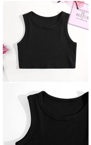 Close-up of black ribbed cotton fabric and neckline on a girls' sleeveless crop top