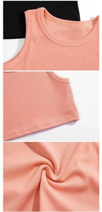 Close-up detail of ribbed cotton fabric and stitching on girls sleeveless tank tops