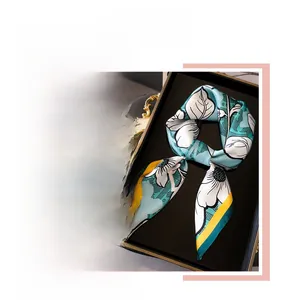 Detail of floral silk scarf with vintage white flowers and yellow contrast borders